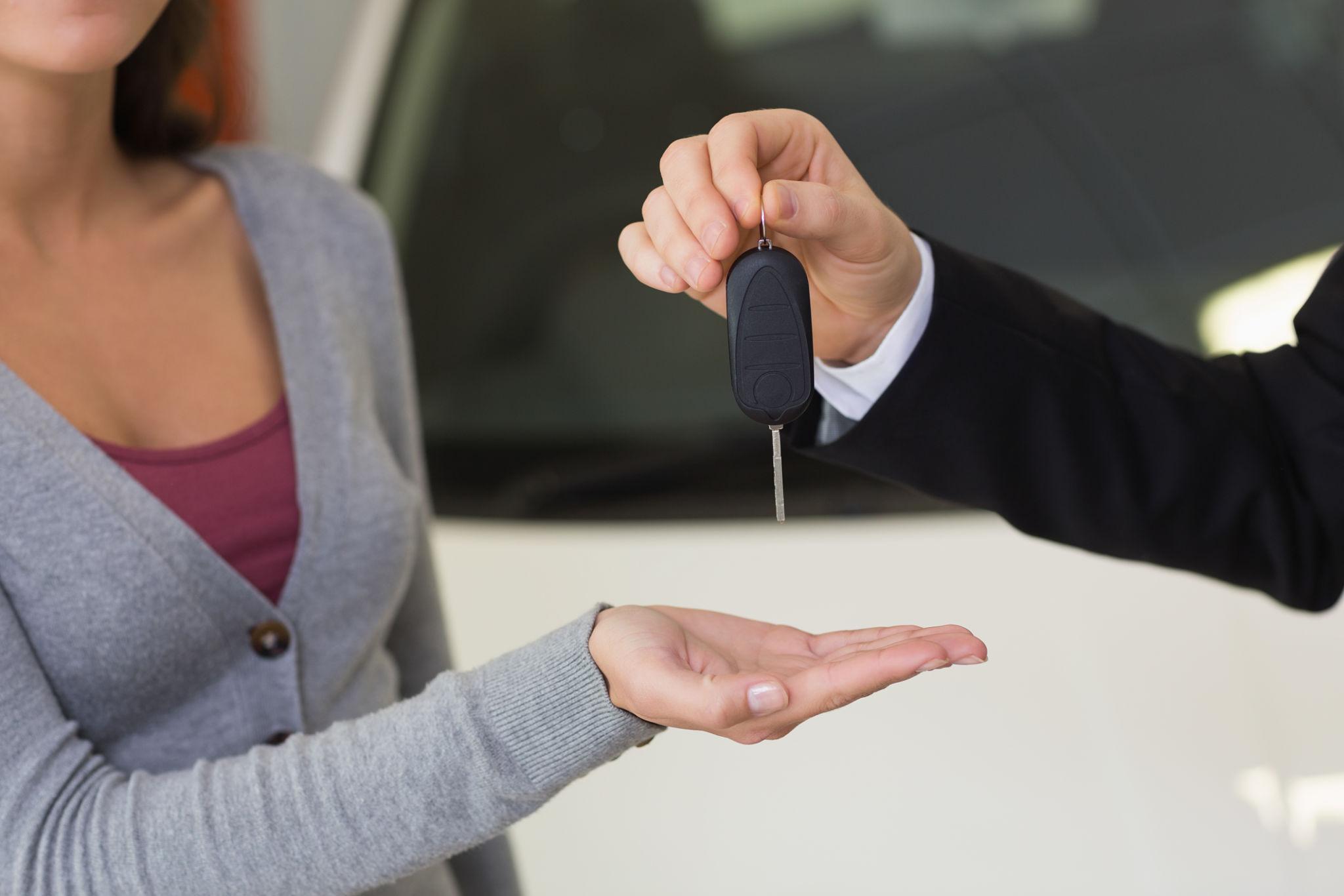 Car keys handover between driver and rental agent